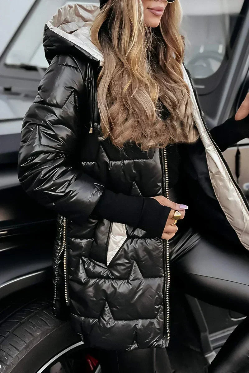 Close-up of the black quilted puffer coat with hood and zip