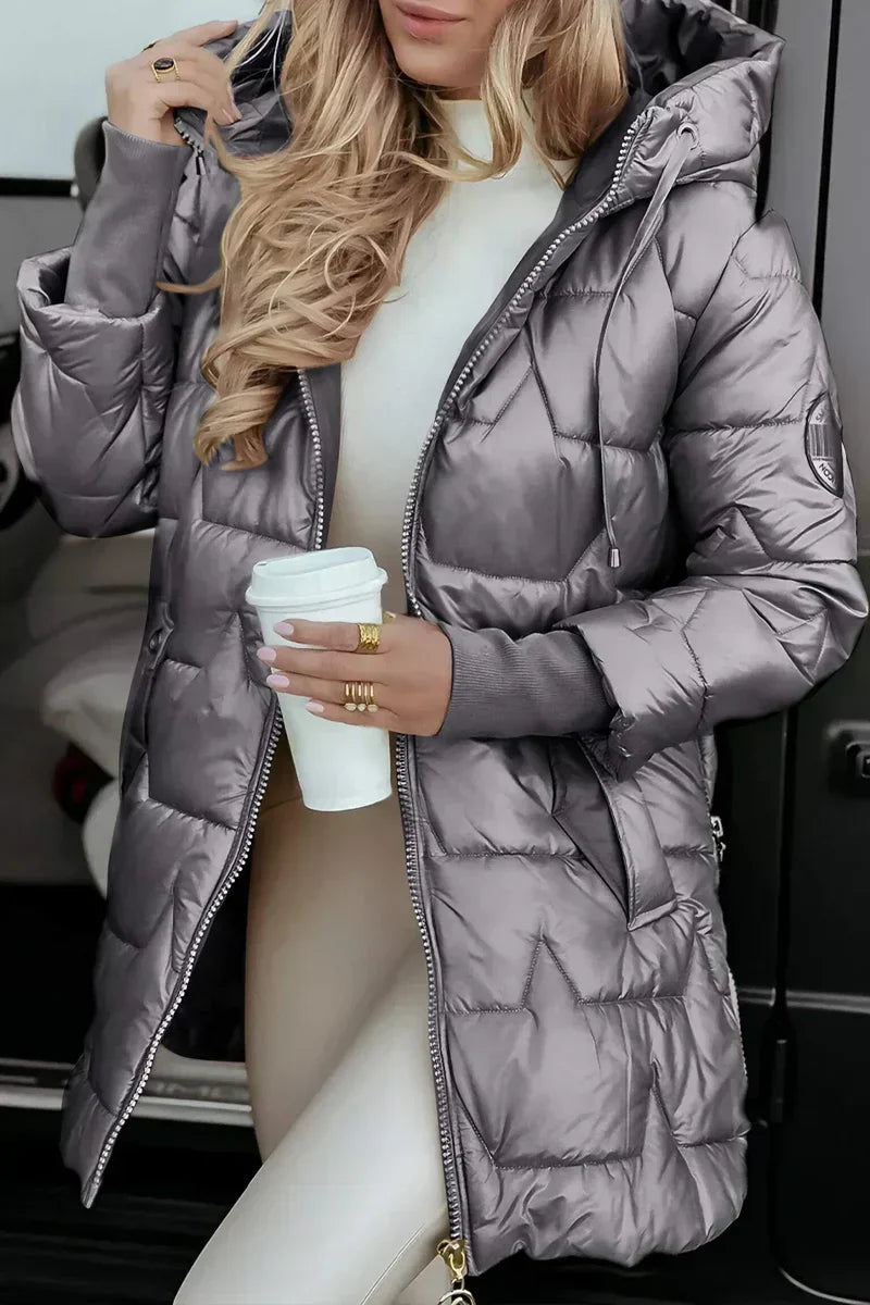 Gray glossy hooded puffer coat, styled with a cream knit top