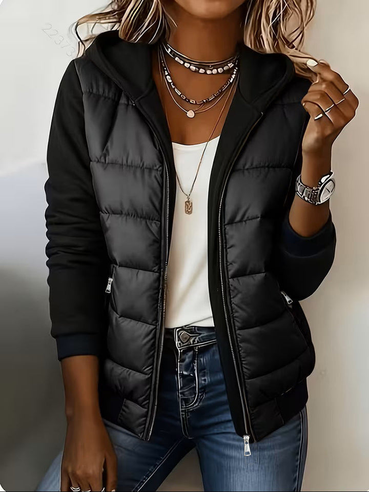 All black puffer jacket with quilted body and knit hood