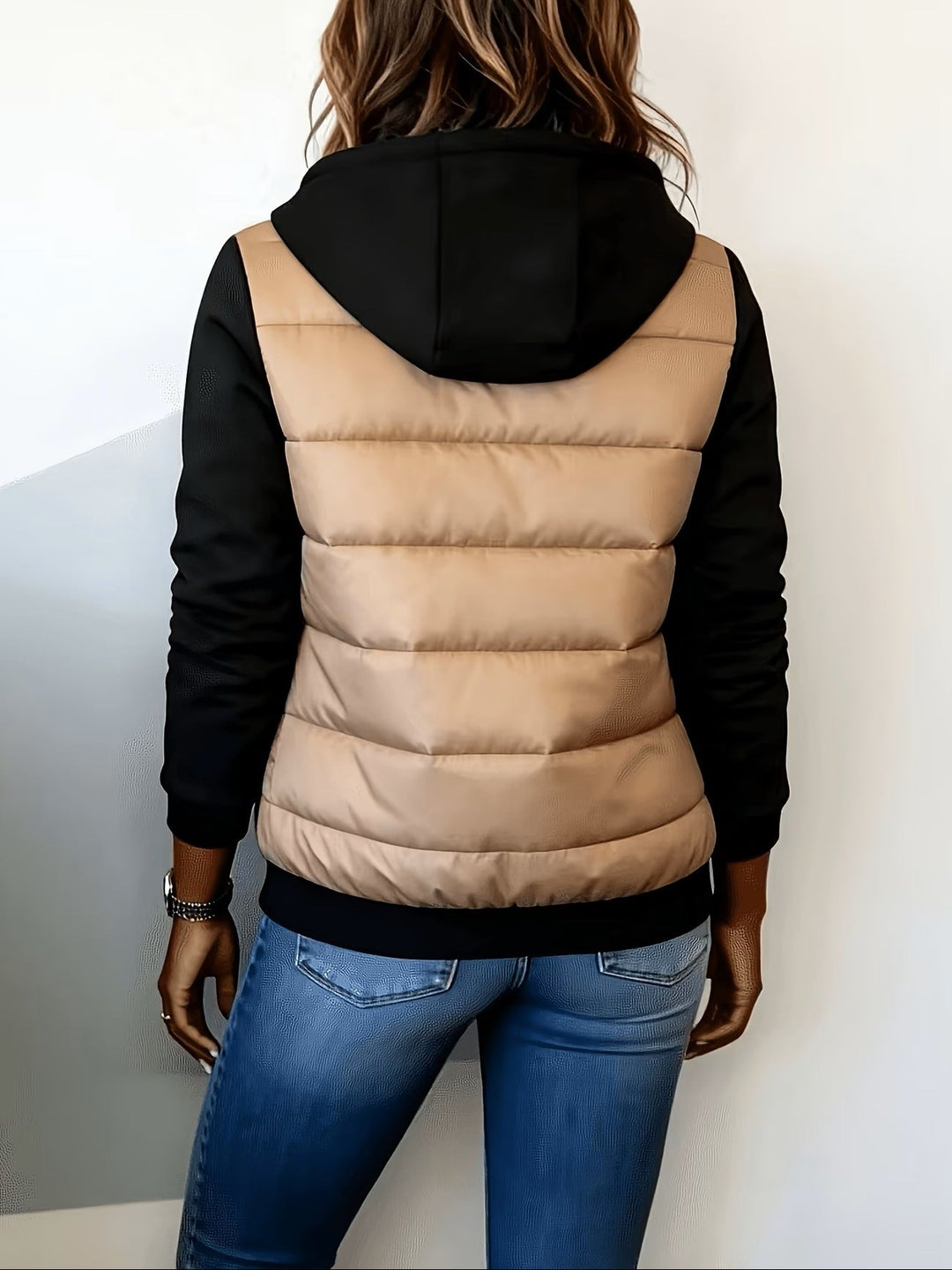 Back of the camel quilted jacket with black hood and sleeves