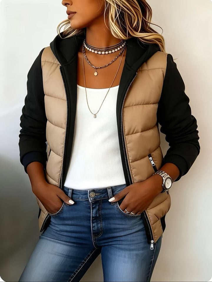 Camel puffer jacket with black knit sleeves and hood, front view