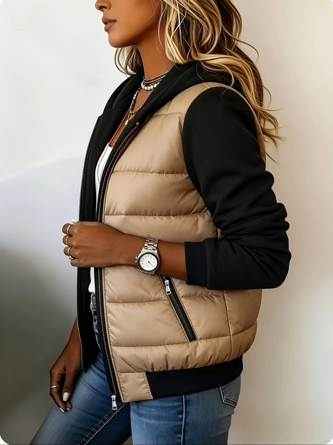 Side view of the camel jacket with zip pocket and ribbed hem
