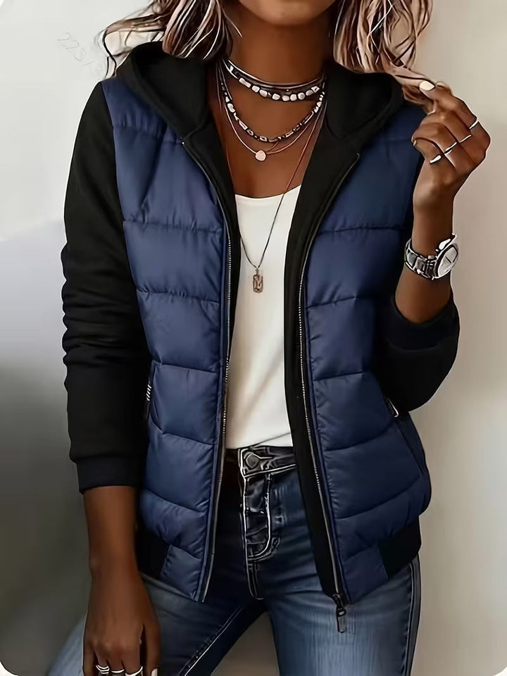 Navy puffer jacket with black hood and contrast sleeves