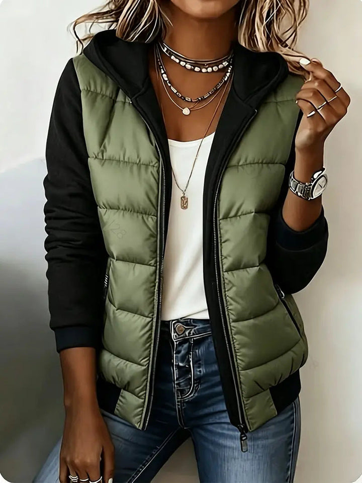 Olive puffer jacket with black sleeves and ribbed hem