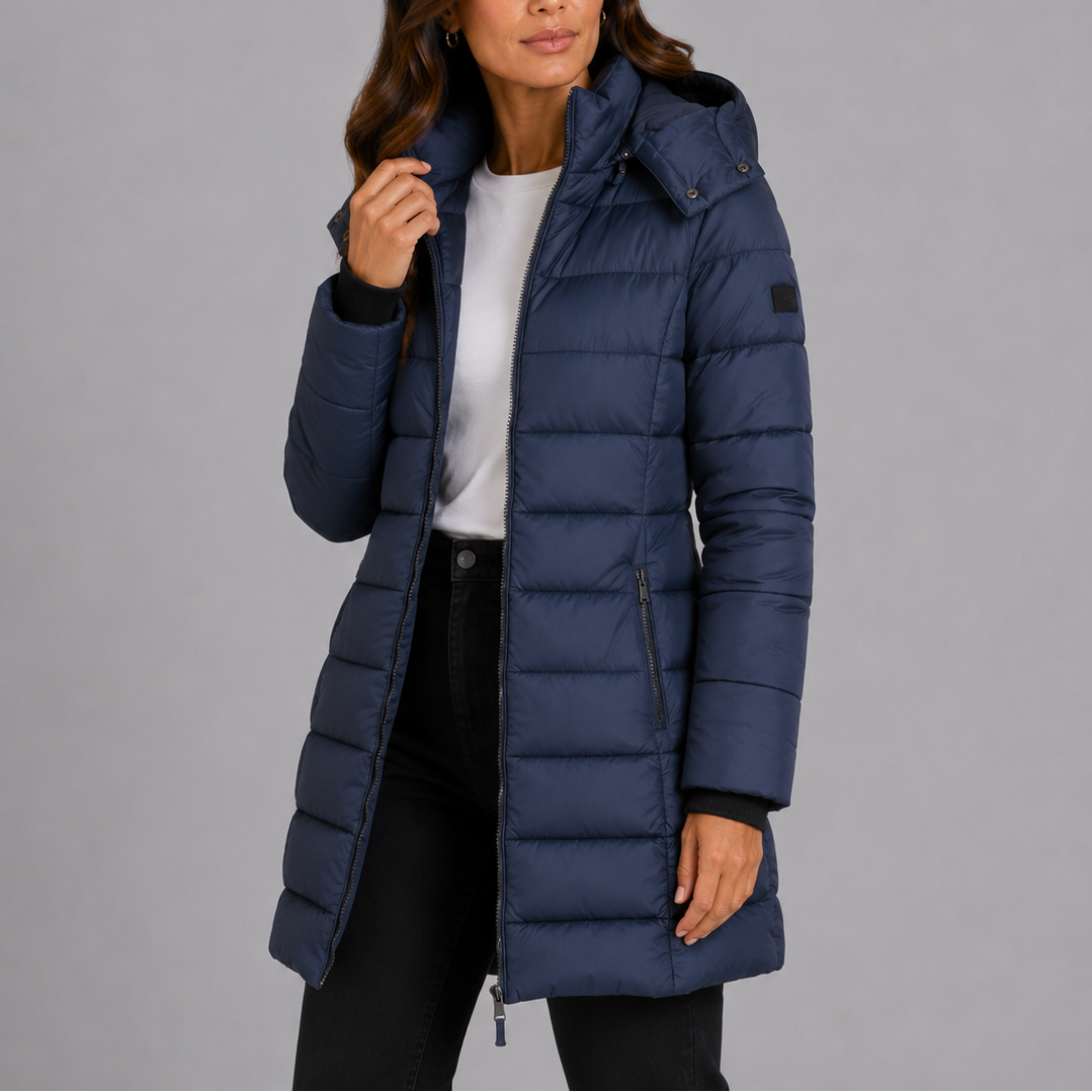 Women's navy long hooded puffer jacket, front view on a model