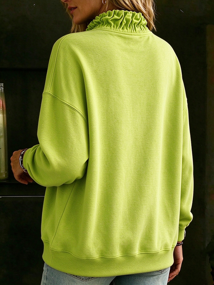 Back view of the lime sweatshirt showing the gathered collar and drop shoulders