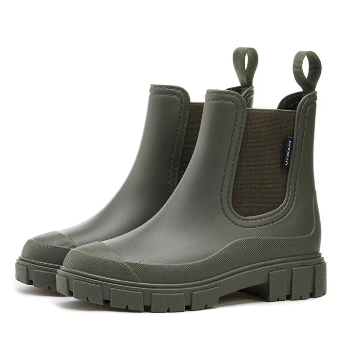 Olive green Chelsea ankle rain boots with chunky tread sole