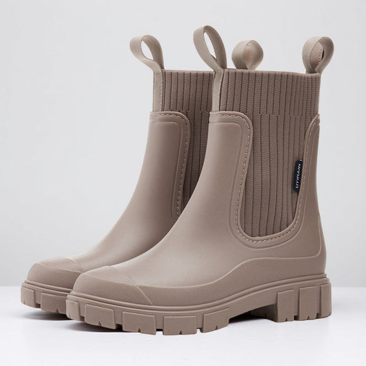 Taupe chelsea rain boots with ribbed knit collar and lug sole
