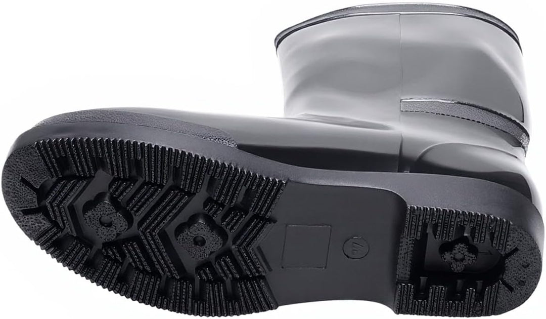 Black rain boot turned on its side to show the deep tread sole