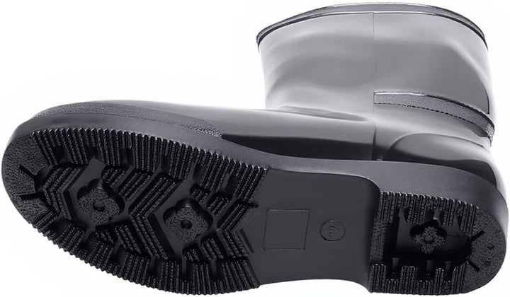 Black rain boot turned on its side to show the deep tread sole