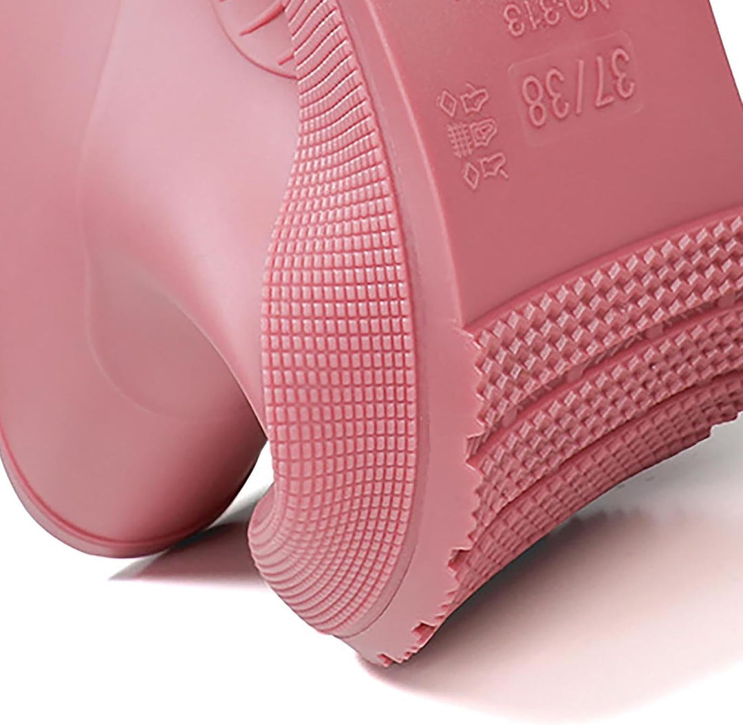 Close-up of the pink rain boot heel and grooved sole detail
