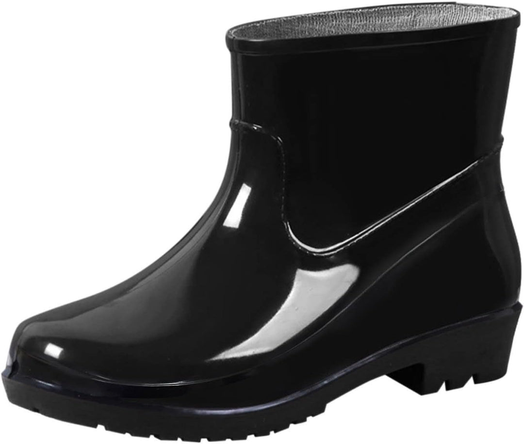 Single black glossy ankle rain boot with low block heel, side view