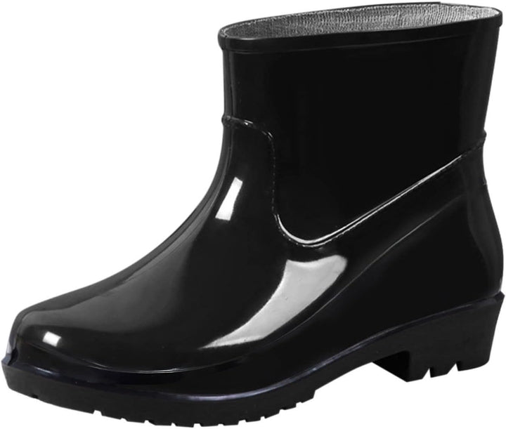Single black glossy ankle rain boot with low block heel, side view