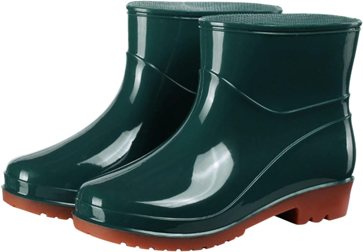 Dark green glossy ankle rain boots with brown heel, pair view