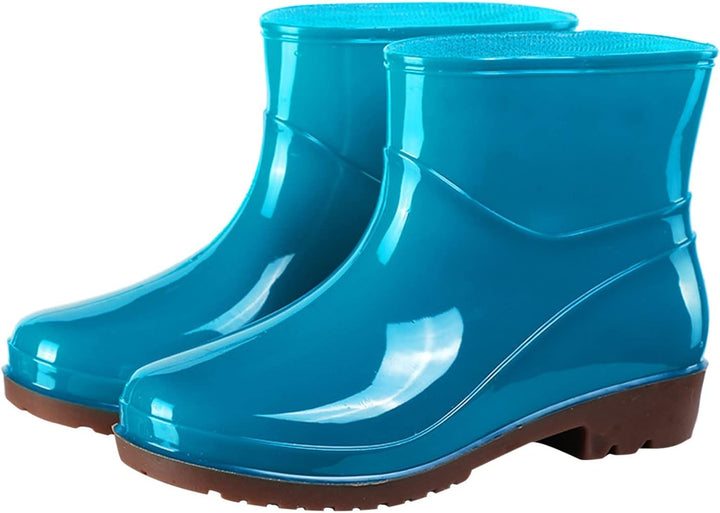 Teal glossy ankle rain boots with low block heel, pair view