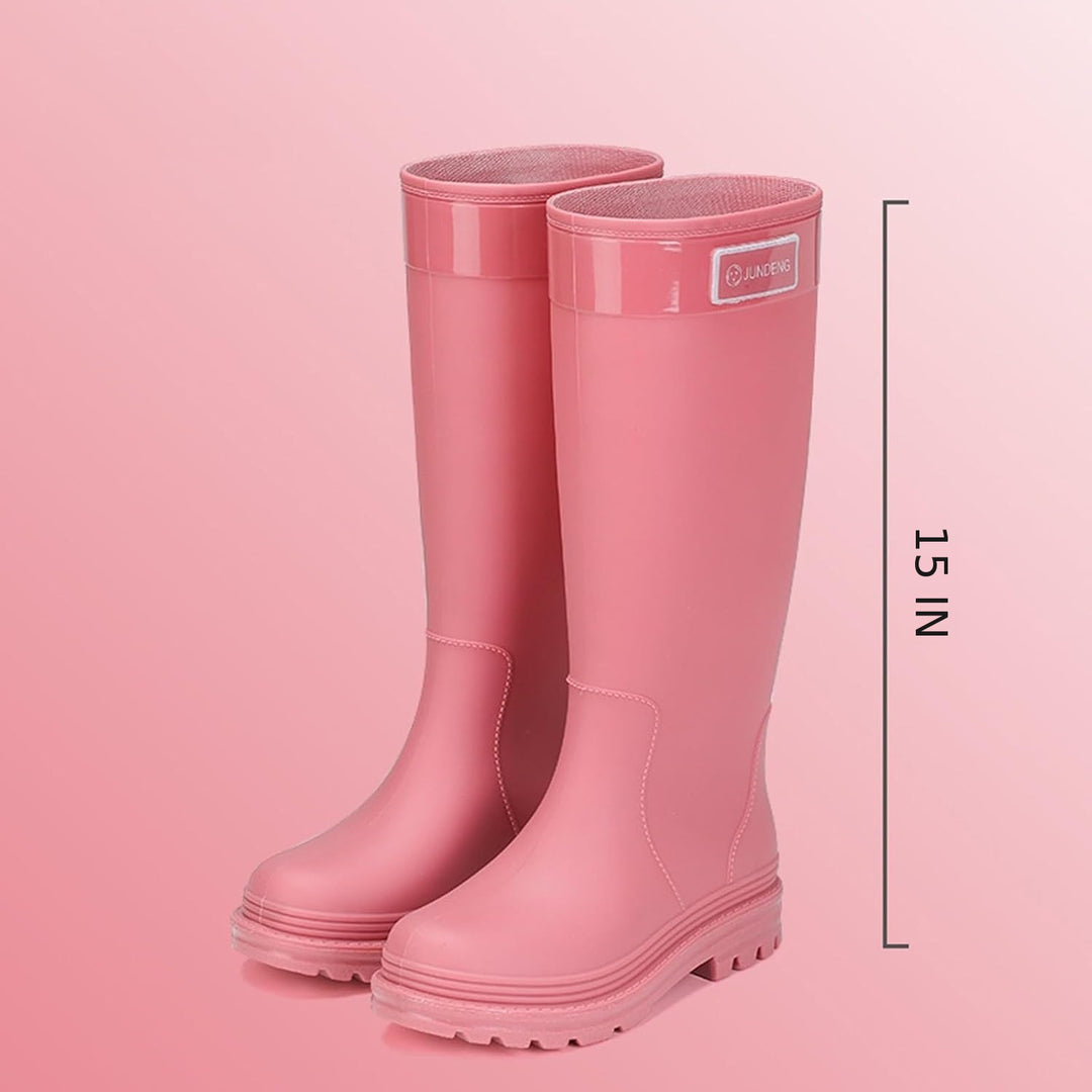 Pair of tall pink matte rain boots with height measurement of 15 inches