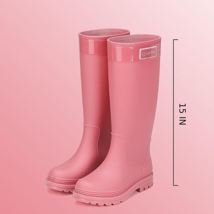 Pair of tall pink matte rain boots with height measurement of 15 inches