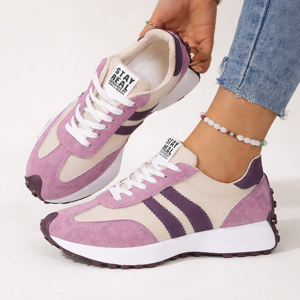 Lilac and cream striped low top sneakers worn with frayed hem jeans
