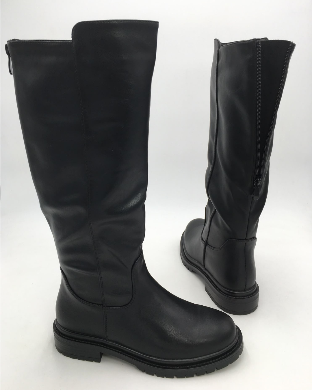 Pair of black knee high riding boots with lug sole, side and back view