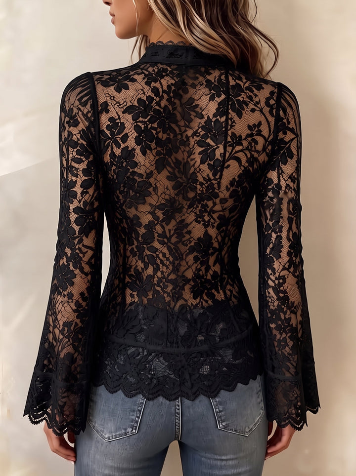 Back view of the black lace top showing the sheer floral pattern