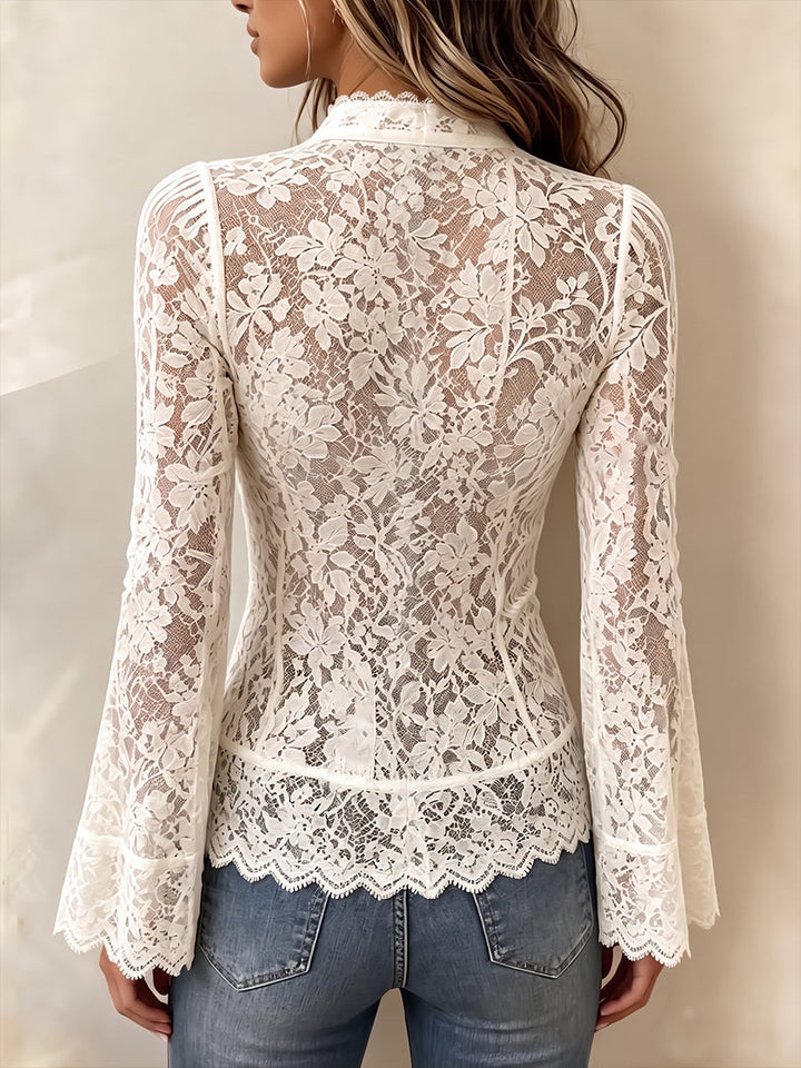 Back of the ivory lace top with floral pattern and scalloped hem