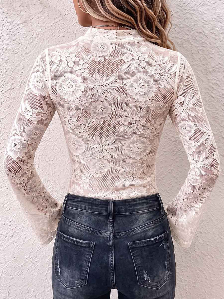 Back of the ivory lace top with flared sleeves and sheer floral pattern