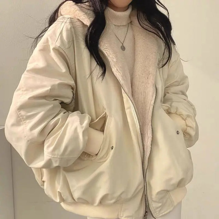 Women's cream sherpa lined bomber jacket, front view on a model