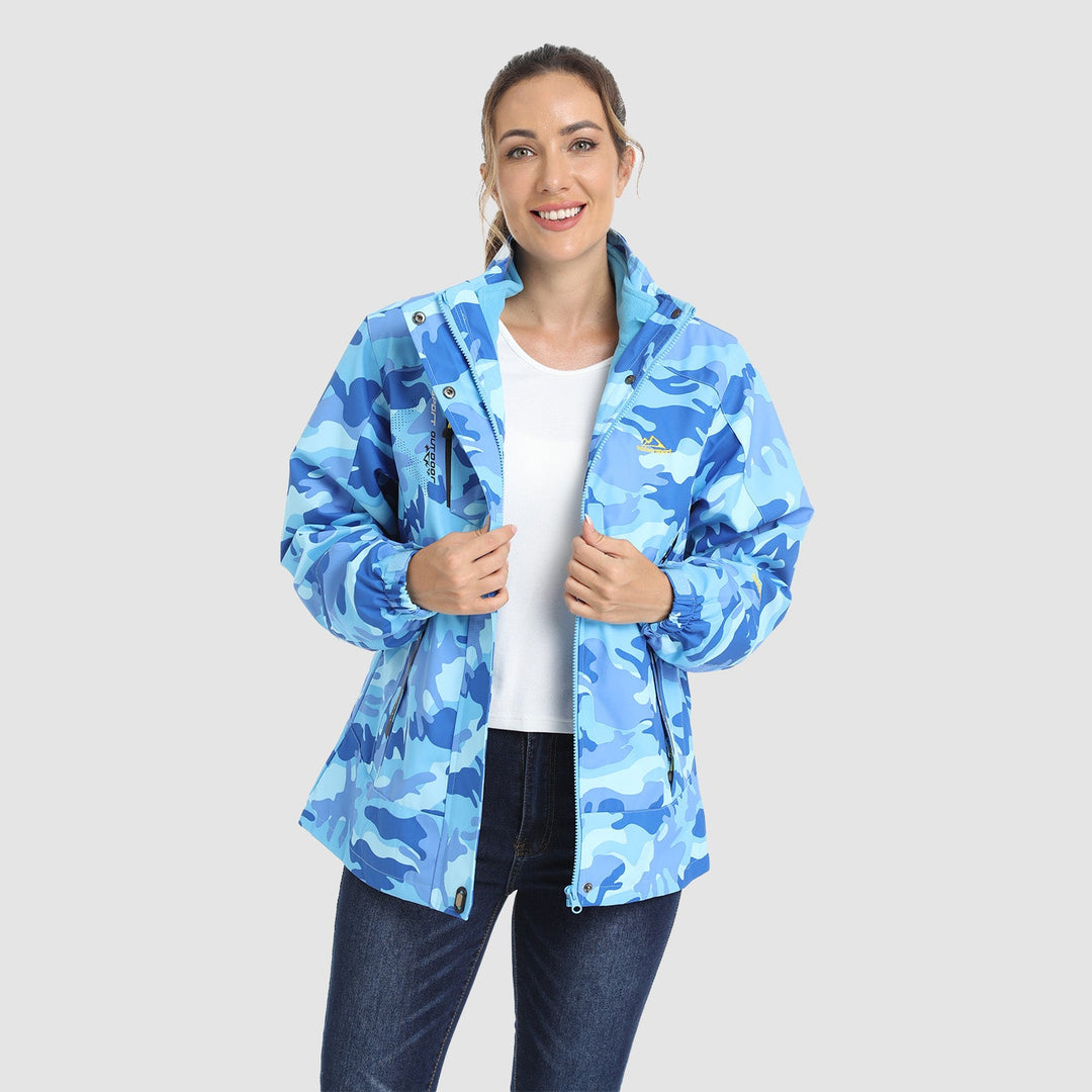 Woman wearing the blue camo winter jacket open over a white tee
