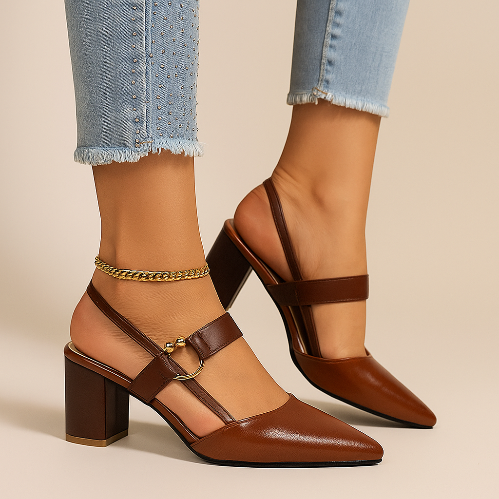 Women's slingback heels in cognac with block heel and ankle strap, worn with cuffed jeans and an ankle chain