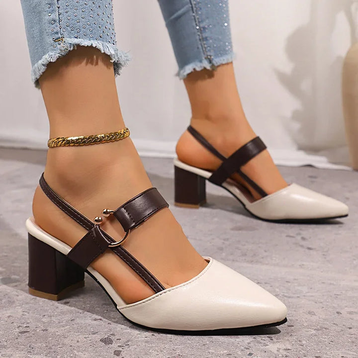 Cream pointed toe slingback pumps with block heel and brown ankle strap, worn with cuffed jeans