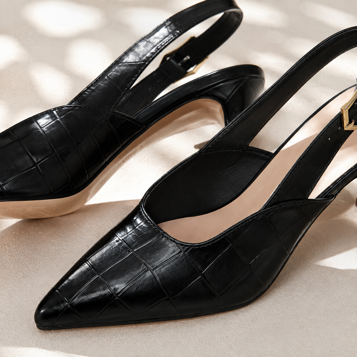 Close-up of the black croc embossed pointed toe slingback shoe