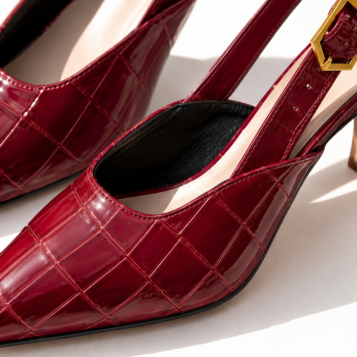 Close-up of the burgundy croc embossed pointed toe slingback and buckle