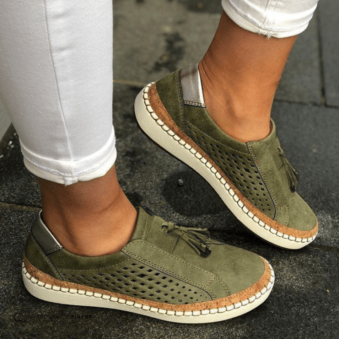 Women's slip on shoes in green, perforated comfort style with stitched sole