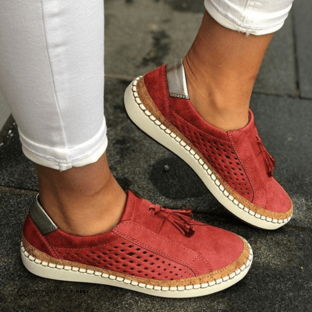 Red perforated slip on shoes with stitched edge