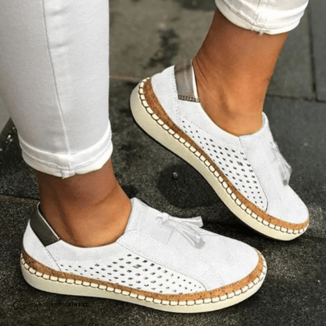 White perforated slip on shoes with contrast sole