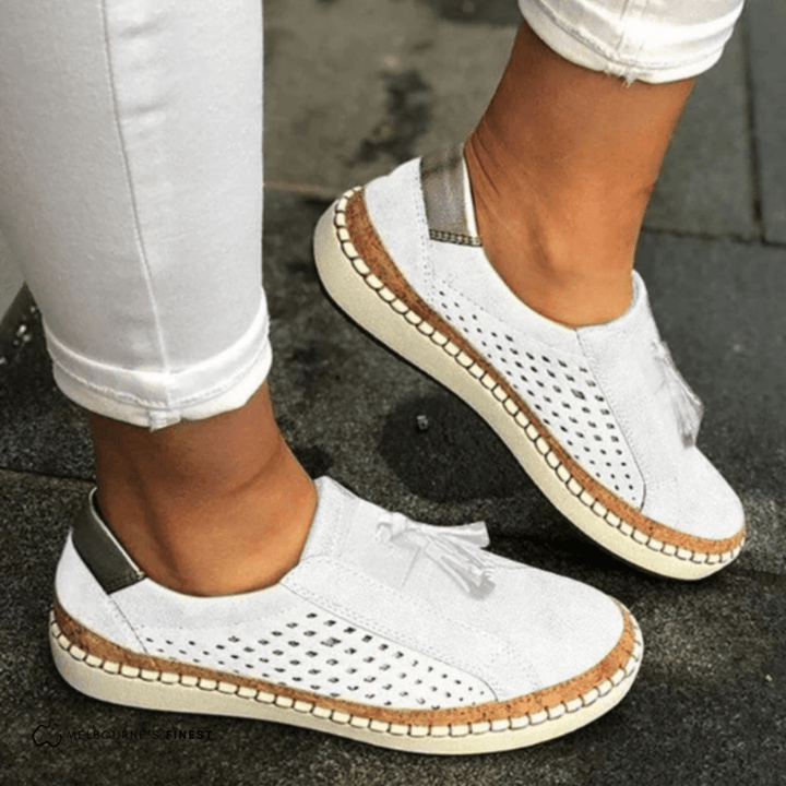 White perforated slip on shoes with contrast sole