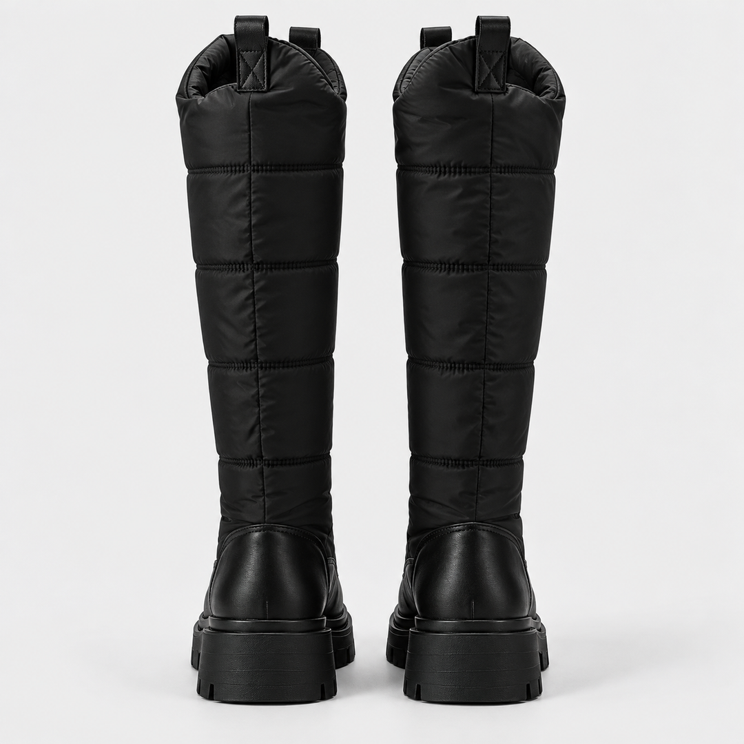 Back view of the pair of black knee high quilted snow boots