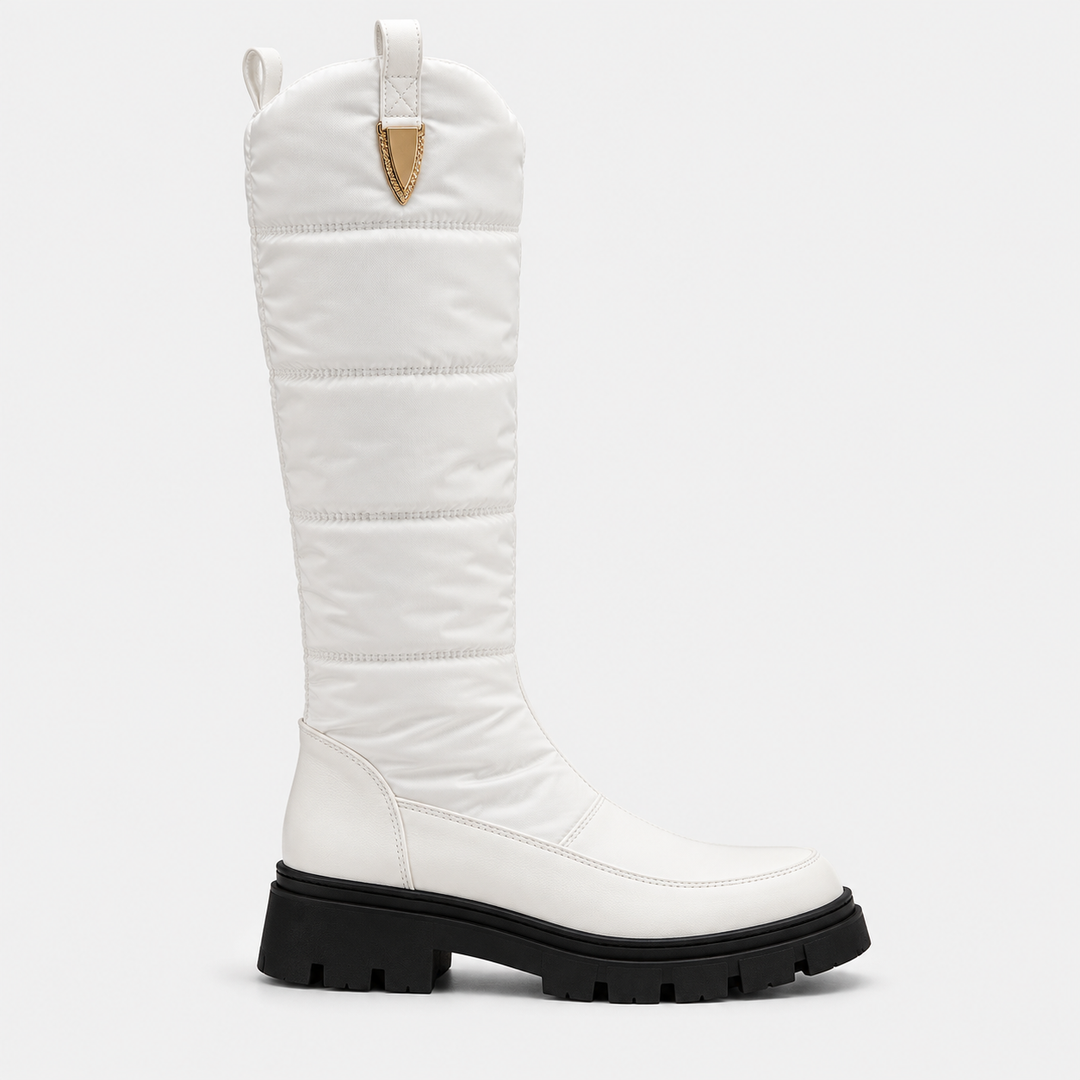 Side view of the white knee high quilted snow boot with black sole