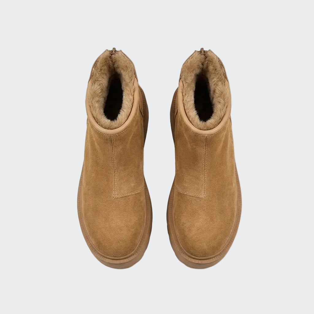 Pair of camel ankle snow boots seen from above with faux fur lining