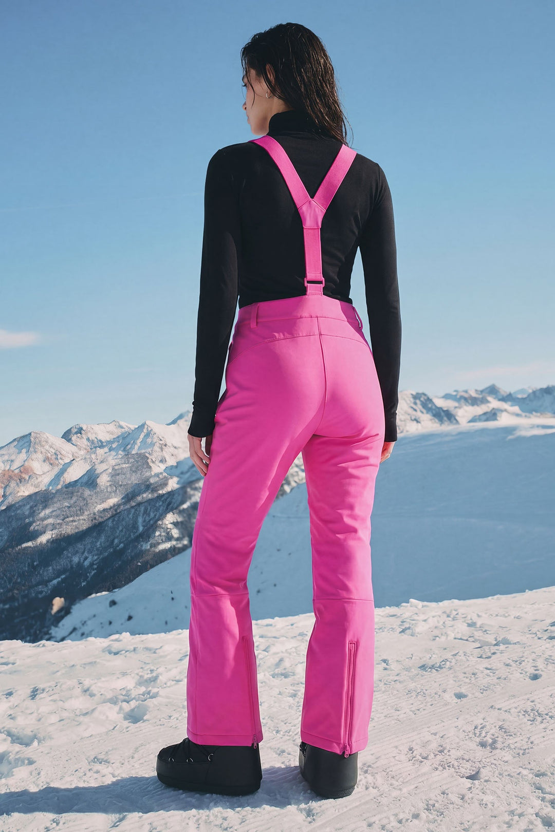 Back view of the fuchsia snow pants with crossed straps