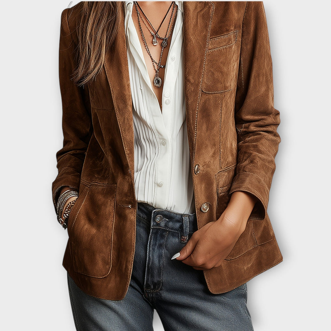 Closer view of the brown suede-look blazer lapel, chest pocket and button front
