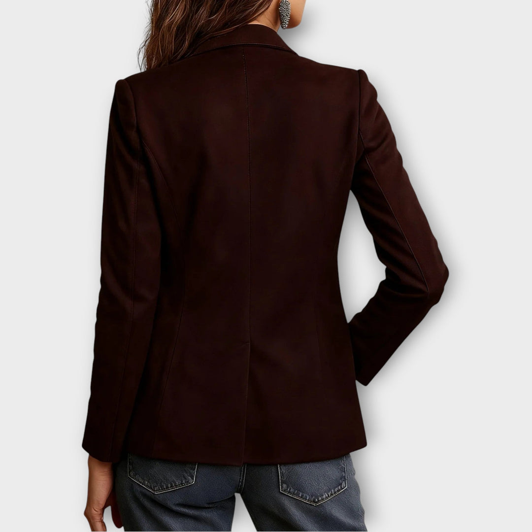 Back view of the dark brown notch lapel blazer on model