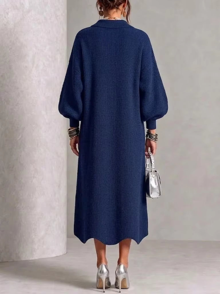 Back view of the navy button down midi dress with long sleeves on a model