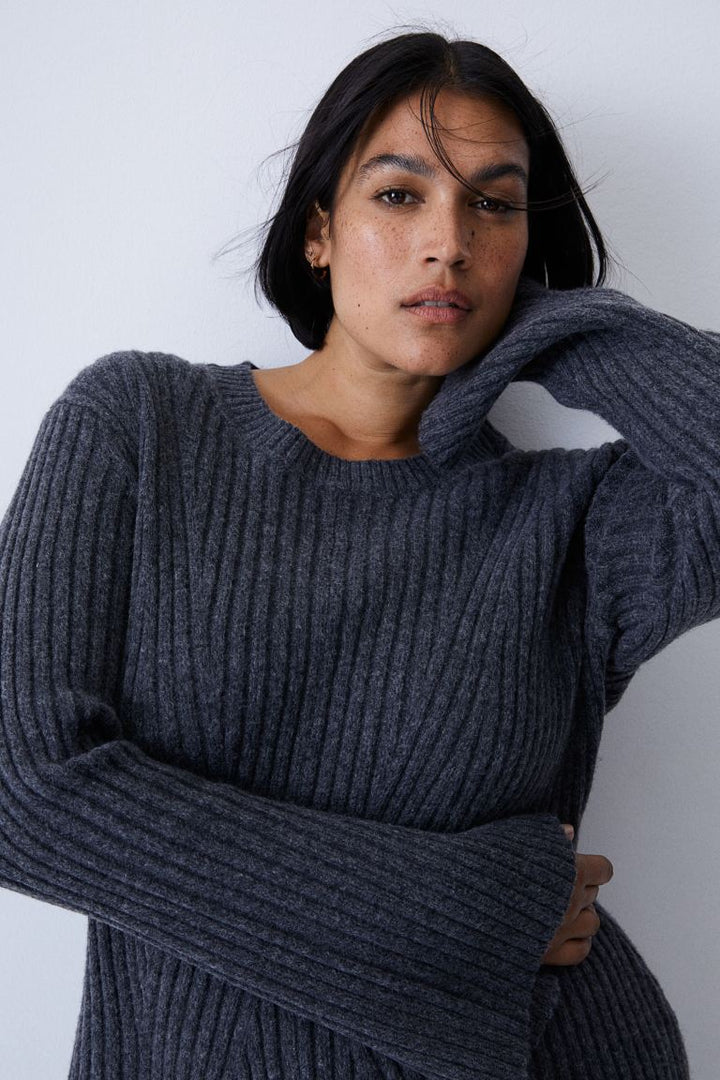 Close up of the charcoal crew neckline and long ribbed sleeves