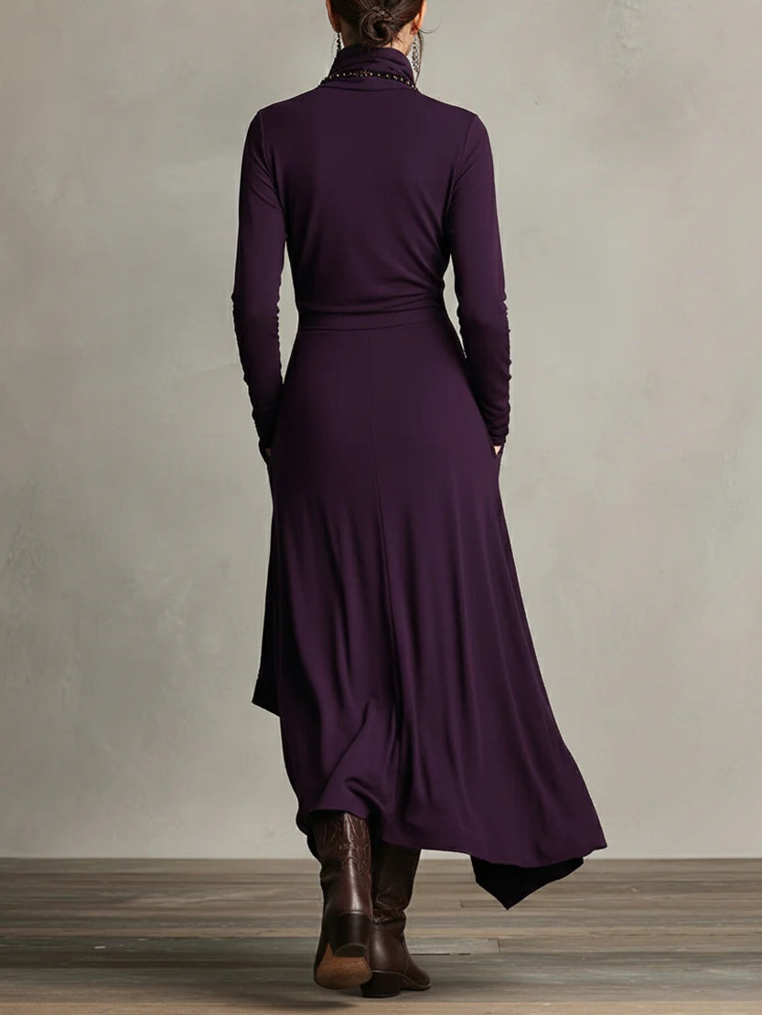 Back view of the plum sweater dress with long sleeves and flowing hem
