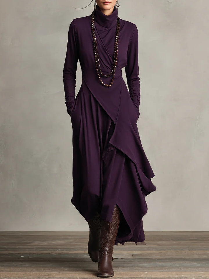 Plum turtleneck maxi sweater dress layered with a beaded necklace, front view