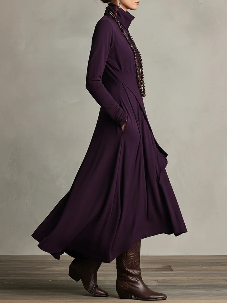 Side view of plum draped maxi dress in motion with tall brown boots