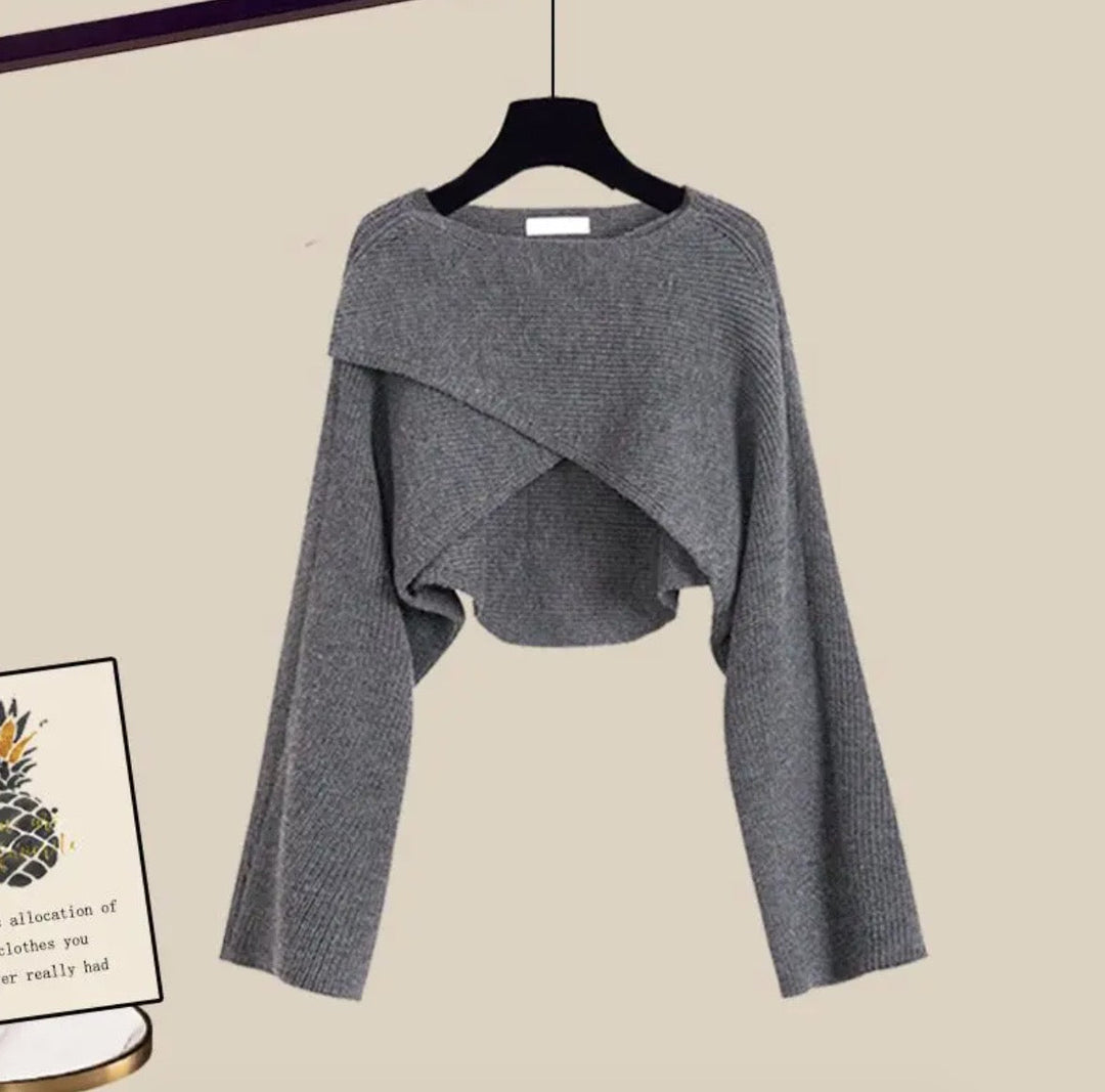 Gray cropped sweater with crossover front and long sleeves, hanging view