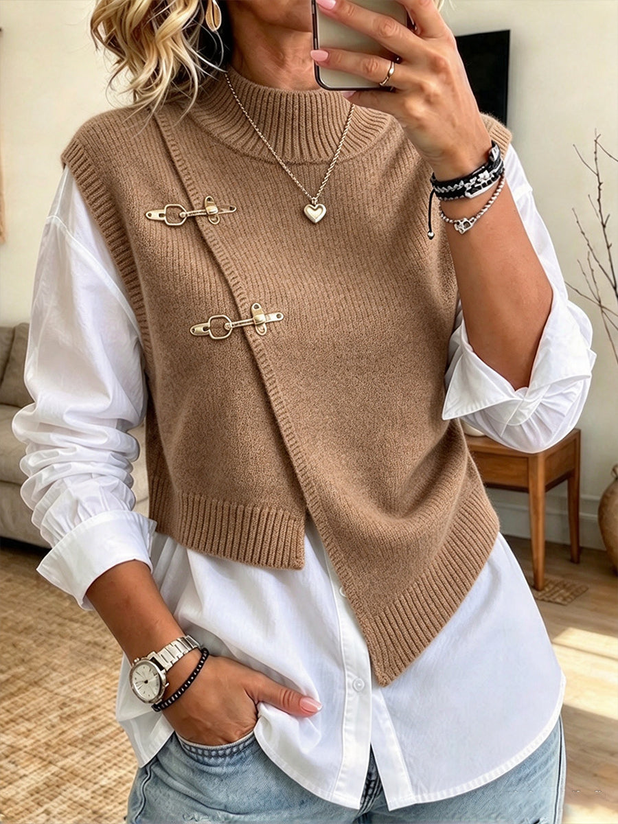 Camel sweater vest layered over the white button-up shirt