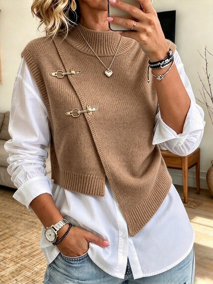 Camel sweater vest layered over the white button-up shirt